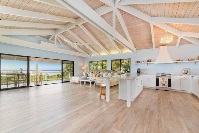 77-172 Kekai Pl, Kailua-Kona, HI 96740 - kitchen featuring stainless steel stove, open shelves, premium range hood, open floor plan, and white cabinets