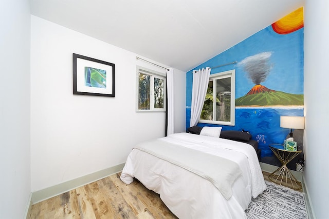 11-2775 Lehua St, Mountain View, HI 96771 - bedroom with lofted ceiling, baseboards, and wood finished floors