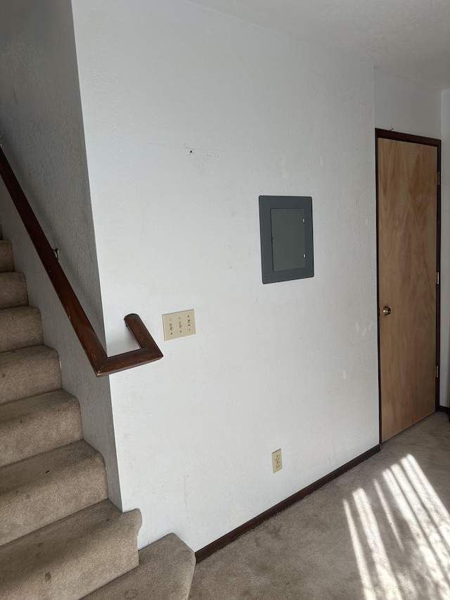 68-1809 Hooko St, Waikoloa, HI 96738 - staircase featuring electric panel, carpet flooring, and baseboards