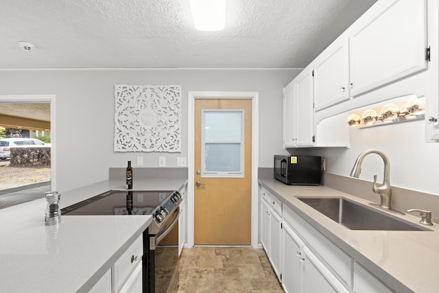 1646 Oneawa Pl, Hilo, HI 96720 - kitchen with range with electric stovetop, a sink, black microwave, a textured ceiling, and white cabinets