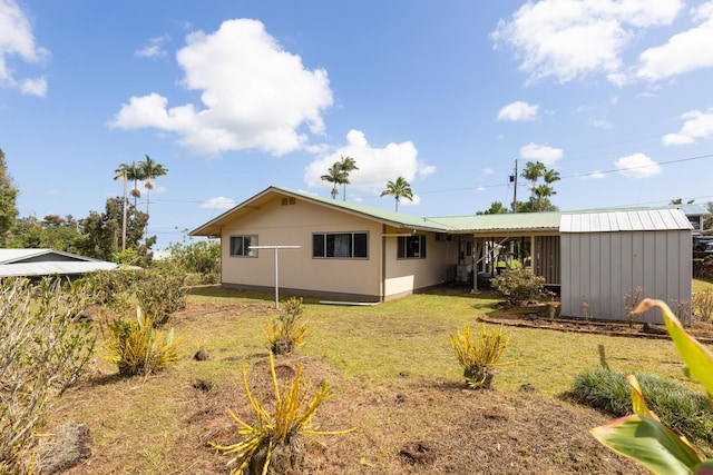 1646 Oneawa Pl, Hilo, HI 96720 - rear view of house featuring a yard and metal roof