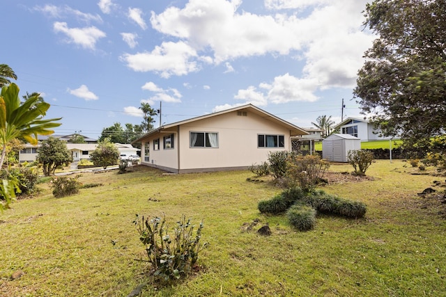 1646 Oneawa Pl, Hilo, HI 96720 - rear view of house featuring a lawn