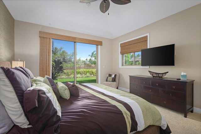 68-1122 Kaniku Dr Unit 111, Kamuela, HI 96743 - bedroom featuring access to exterior, light colored carpet, a ceiling fan, baseboards, and vaulted ceiling
