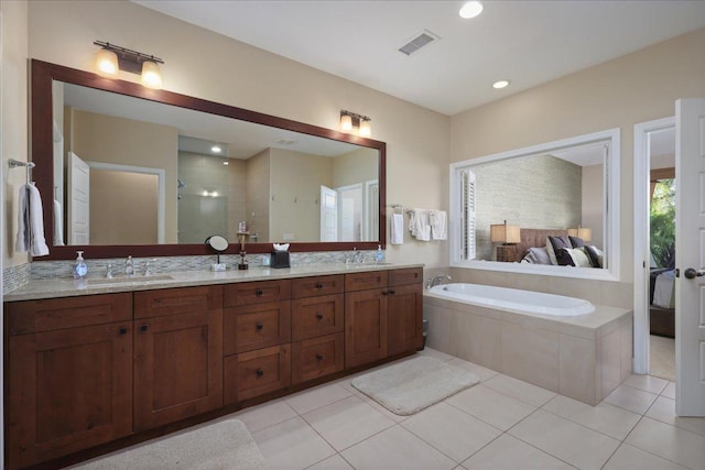 68-1122 Kaniku Dr Unit 111, Kamuela, HI 96743 - bathroom featuring double vanity, a bath, tile patterned flooring, tiled shower, and recessed lighting