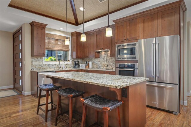 68-1122 Kaniku Dr Unit 111, Kamuela, HI 96743 - kitchen featuring appliances with stainless steel finishes, backsplash, a sink, baseboards, and crown molding