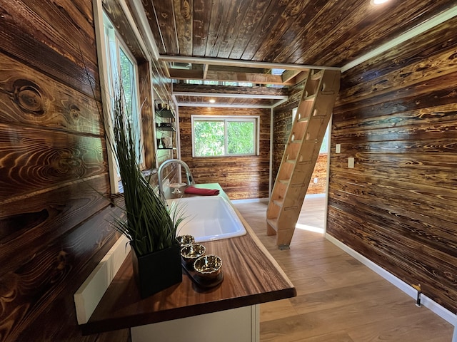 12-7010 Nahokulele St, Pahoa, HI 96778 - sitting room featuring wooden walls, wood ceiling, wood finished floors, and baseboards