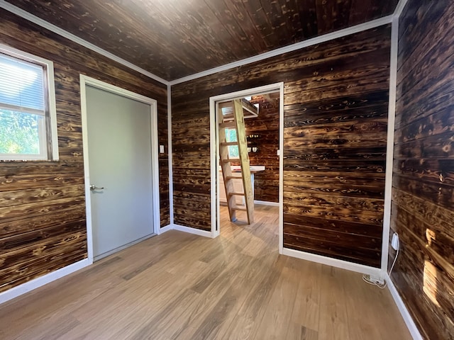 12-7010 Nahokulele St, Pahoa, HI 96778 - unfurnished room with wood finished floors, wood walls, baseboards, and crown molding