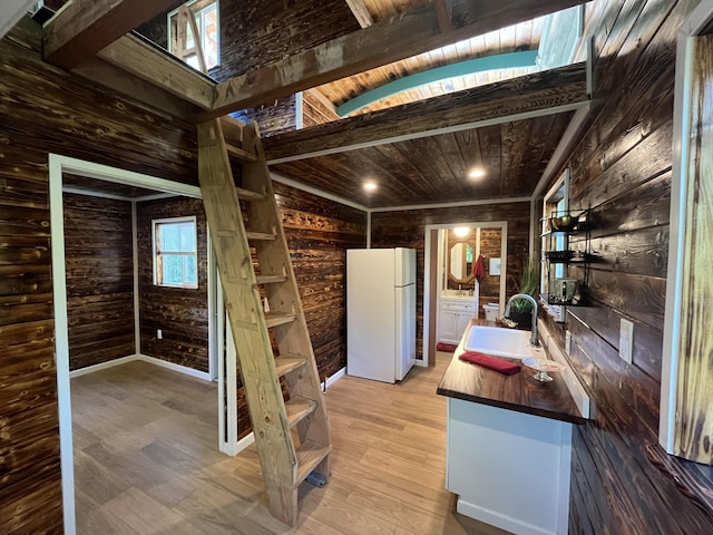 12-7010 Nahokulele St, Pahoa, HI 96778 - kitchen with freestanding refrigerator, a sink, butcher block counters, wood walls, and wood ceiling