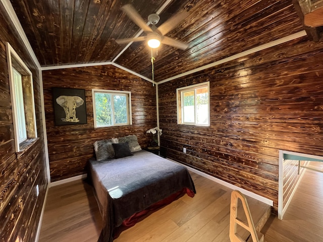 12-7010 Nahokulele St, Pahoa, HI 96778 - bedroom with wooden ceiling, wooden walls, hardwood / wood-style floors, lofted ceiling, and baseboards