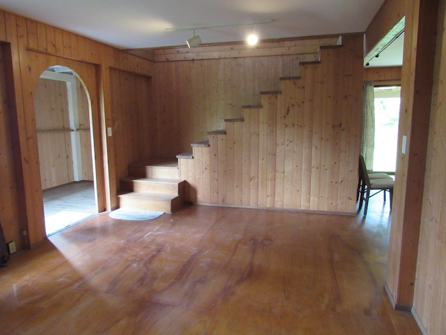 12-567 Aloha Rd, Pahoa, HI 96778 - staircase with wood walls, hardwood / wood-style flooring, arched walkways, and track lighting