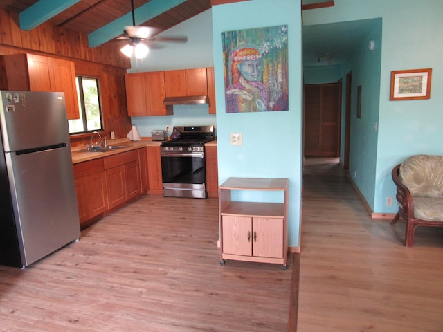 12-567 Aloha Rd, Pahoa, HI 96778 - kitchen with stainless steel appliances, under cabinet range hood, a sink, ceiling fan, and light wood finished floors