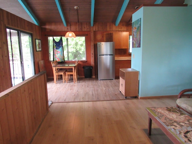 12-567 Aloha Rd, Pahoa, HI 96778 - dining room featuring healthy amount of natural light, light wood-type flooring, wood walls, and baseboards