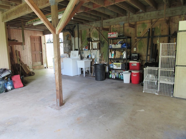 12-567 Aloha Rd, Pahoa, HI 96778 - below grade area with washing machine and clothes dryer, electric panel, and a sink