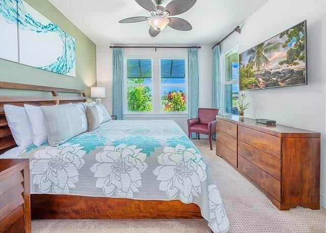 2611 Kiahuna Plantation Dr Unit 8J, Koloa, HI 96756 - carpeted bedroom with multiple windows and a ceiling fan