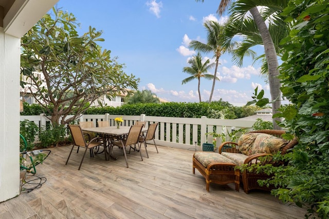 75-6081 Alii Dr Unit V101, Kailua-Kona, HI 96740 - wooden terrace with outdoor dining area
