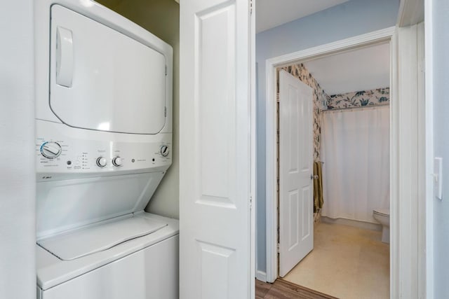 75-6081 Alii Dr Unit V101, Kailua-Kona, HI 96740 - laundry room featuring stacked washing machine and dryer