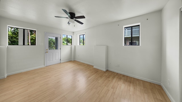 411 Molo St, Kapaa, HI 96746 - empty room with light wood finished floors, baseboards, and a ceiling fan