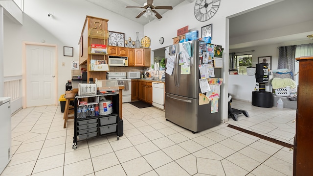 411 Molo St, Kapaa, HI 96746 - kitchen with white appliances, ceiling fan, light tile patterned floors, decorative backsplash, and brown cabinetry