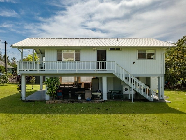 5527 Weke Rd, Hanalei, HI 96714 - rear view of house with a patio area, stairway, a yard, and metal roof