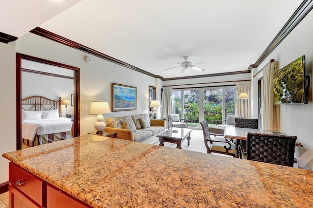 4-820 Kuhio Hwy Unit C104, Kapaa, HI 96746 - kitchen with ornamental molding, a ceiling fan, light stone counters, and open floor plan