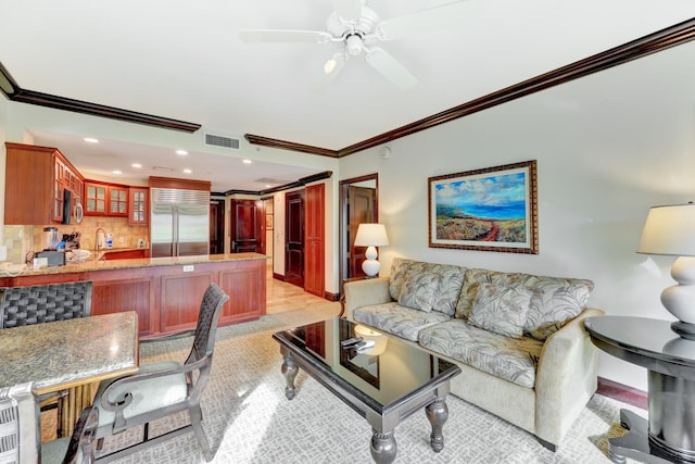 4-820 Kuhio Hwy Unit C104, Kapaa, HI 96746 - living area featuring crown molding, recessed lighting, ceiling fan, and baseboards