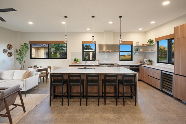 5020 Lau Nahele St, Koloa, HI 96756 - kitchen featuring modern cabinets, wine cooler, a sink, recessed lighting, and range hood