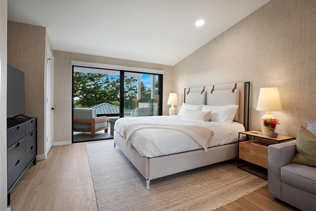 5020 Lau Nahele St, Koloa, HI 96756 - bedroom featuring lofted ceiling, access to exterior, light wood-type flooring, recessed lighting, and baseboards