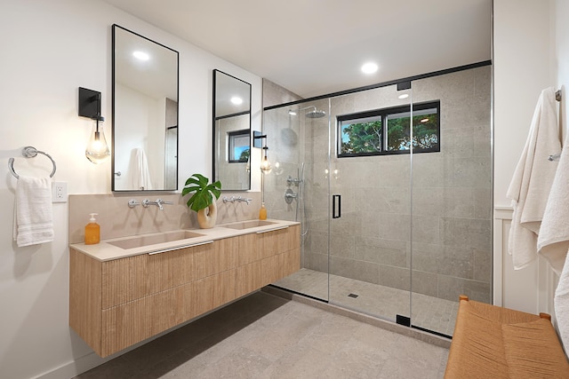 5020 Lau Nahele St, Koloa, HI 96756 - bathroom featuring a shower stall, double vanity, recessed lighting, and tasteful backsplash