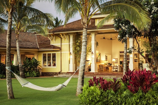 5020 Lau Nahele St, Koloa, HI 96756 - rear view of property with ceiling fan and a yard