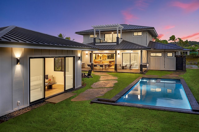 5020 Lau Nahele St, Koloa, HI 96756 - back of house with a standing seam roof, board and batten siding, metal roof, and a pergola