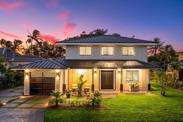 5020 Lau Nahele St, Koloa, HI 96756 - view of front facade with metal roof, covered porch, a standing seam roof, driveway, and board and batten siding