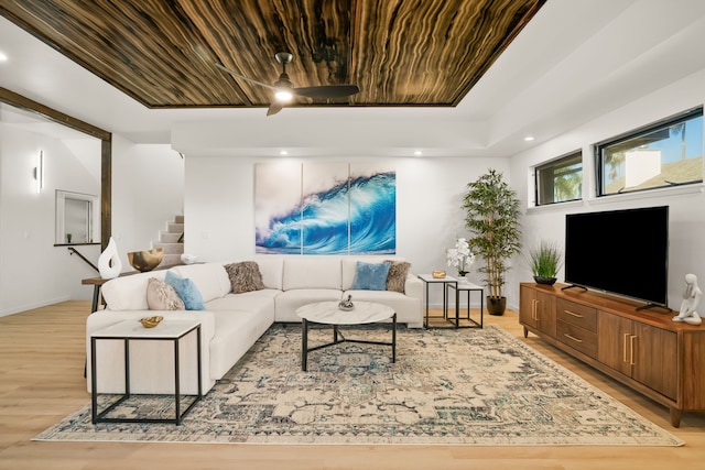 3973 Kalakaua Pl, Princeville, HI 96722 - living area featuring light wood finished floors, stairway, a ceiling fan, and baseboards