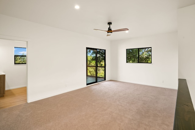 3973 Kalakaua Pl, Princeville, HI 96722 - unfurnished room with healthy amount of natural light, light colored carpet, recessed lighting, a ceiling fan, and baseboards