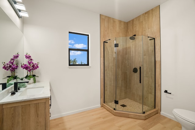 3973 Kalakaua Pl, Princeville, HI 96722 - bathroom featuring vanity, wood finished floors, toilet, and a stall shower