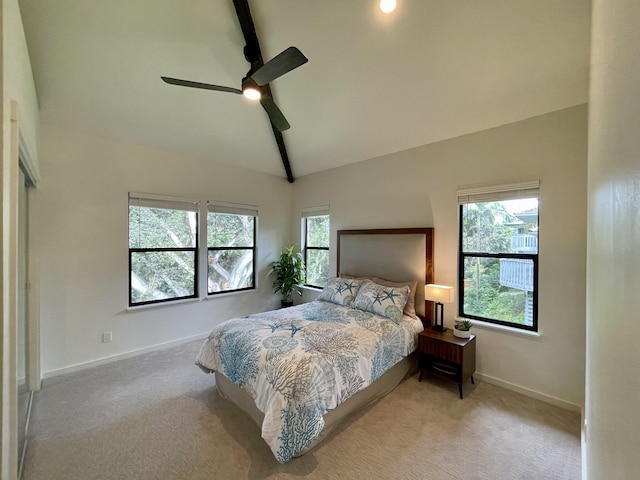 3973 Kalakaua Pl, Princeville, HI 96722 - carpeted bedroom with multiple windows, baseboards, ceiling fan, and high vaulted ceiling