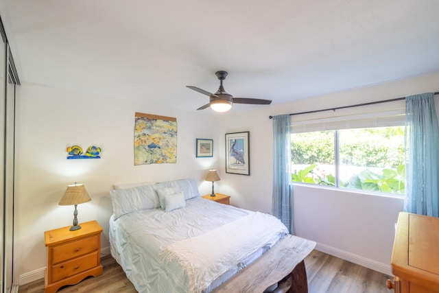 75-6081 Alii Dr Unit O103, Kailua-Kona, HI 96740 - bedroom with light wood-style floors, baseboards, and a ceiling fan