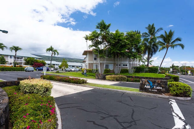75-6081 Alii Dr Unit O103, Kailua-Kona, HI 96740 - view of asphalt road featuring street lights