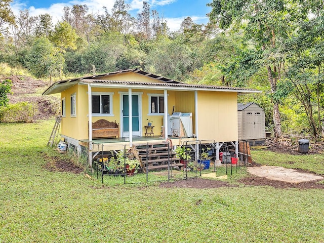 87-1081 Haleili Rd, Captain Cook, HI 96704 - rear view of house with metal roof and covered porch