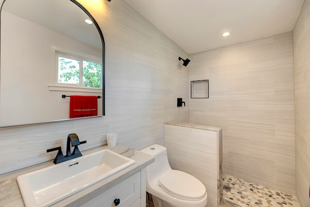 12-266 Mapuana Ave, Pahoa, HI 96778 - full bathroom with tile walls, a tile shower, vanity, toilet, and decorative backsplash
