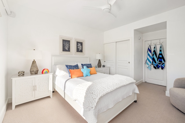 1831 Poipu Rd Unit 720, Koloa, HI 96756 - bedroom featuring light carpet, a closet, baseboards, and a ceiling fan
