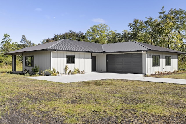 15-1615 13th Ave, Keaau, HI 96749 - modern farmhouse featuring a garage, driveway, a front yard, and metal roof