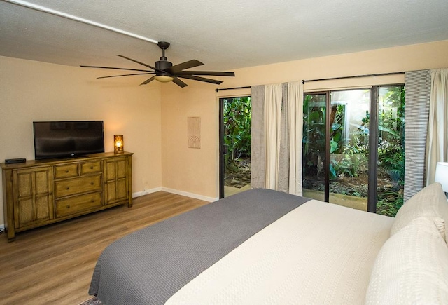 3920 Wyllie Rd Unit 9A, Princeville, HI 96722 - bedroom with wood finished floors, access to outside, baseboards, and a ceiling fan