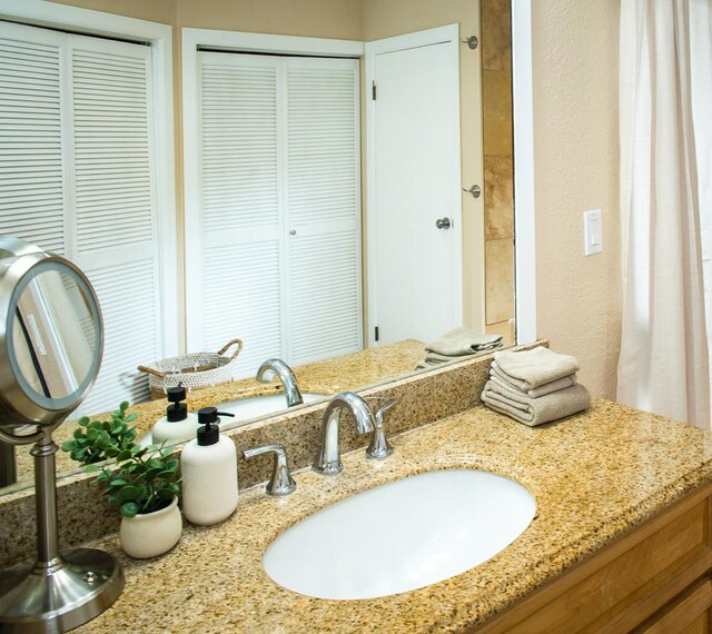 3920 Wyllie Rd Unit 9A, Princeville, HI 96722 - bathroom with a closet and vanity