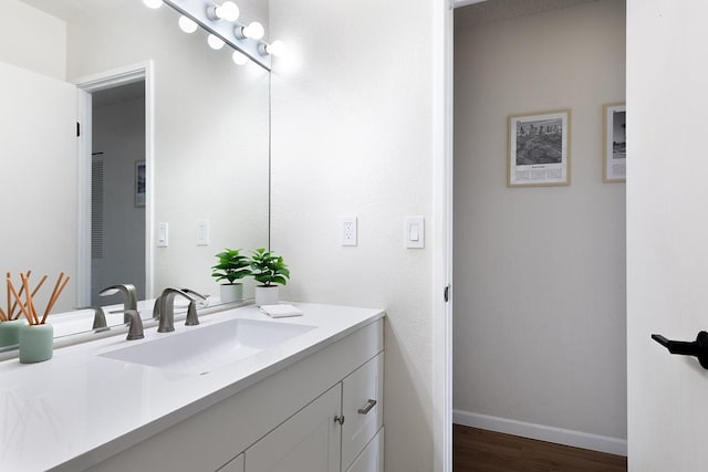79-7199 Mamalahoa Hwy Unit 247, Holualoa, HI 96725 - bathroom with vanity, wood finished floors, and baseboards