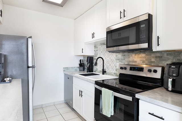 79-7199 Mamalahoa Hwy Unit 247, Holualoa, HI 96725 - kitchen with appliances with stainless steel finishes, a sink, light countertops, and tasteful backsplash