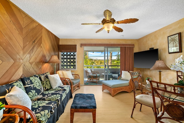 525 Aleka Lp Unit K12, Kapaa, HI 96746 - living room featuring wood finished floors, a ceiling fan, and a textured ceiling