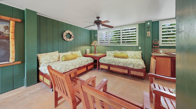 4446 Aku Rd, Hanalei, HI 96714 - bedroom with multiple windows, concrete floors, ceiling fan, and wooden walls