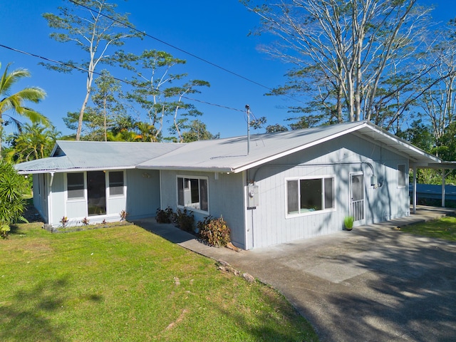 16-1321 Pohaku Cir, Keaau, HI 96749 - ranch-style house with a front lawn and driveway