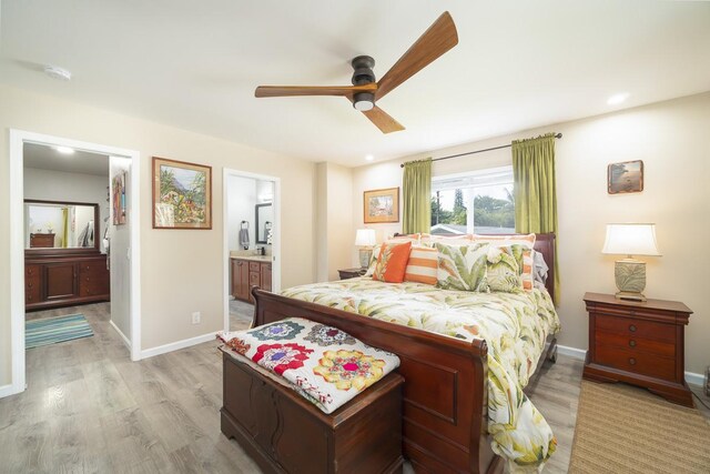 15-885 Paradise Ala Kai Dr, Keaau, HI 96749 - bedroom featuring light wood-style floors, ensuite bath, baseboards, a ceiling fan, and recessed lighting