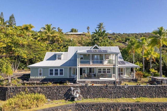 82-5957 Wakida Dr, Captain Cook, HI 96704 - rear view of property with a balcony, a patio area, and metal roof